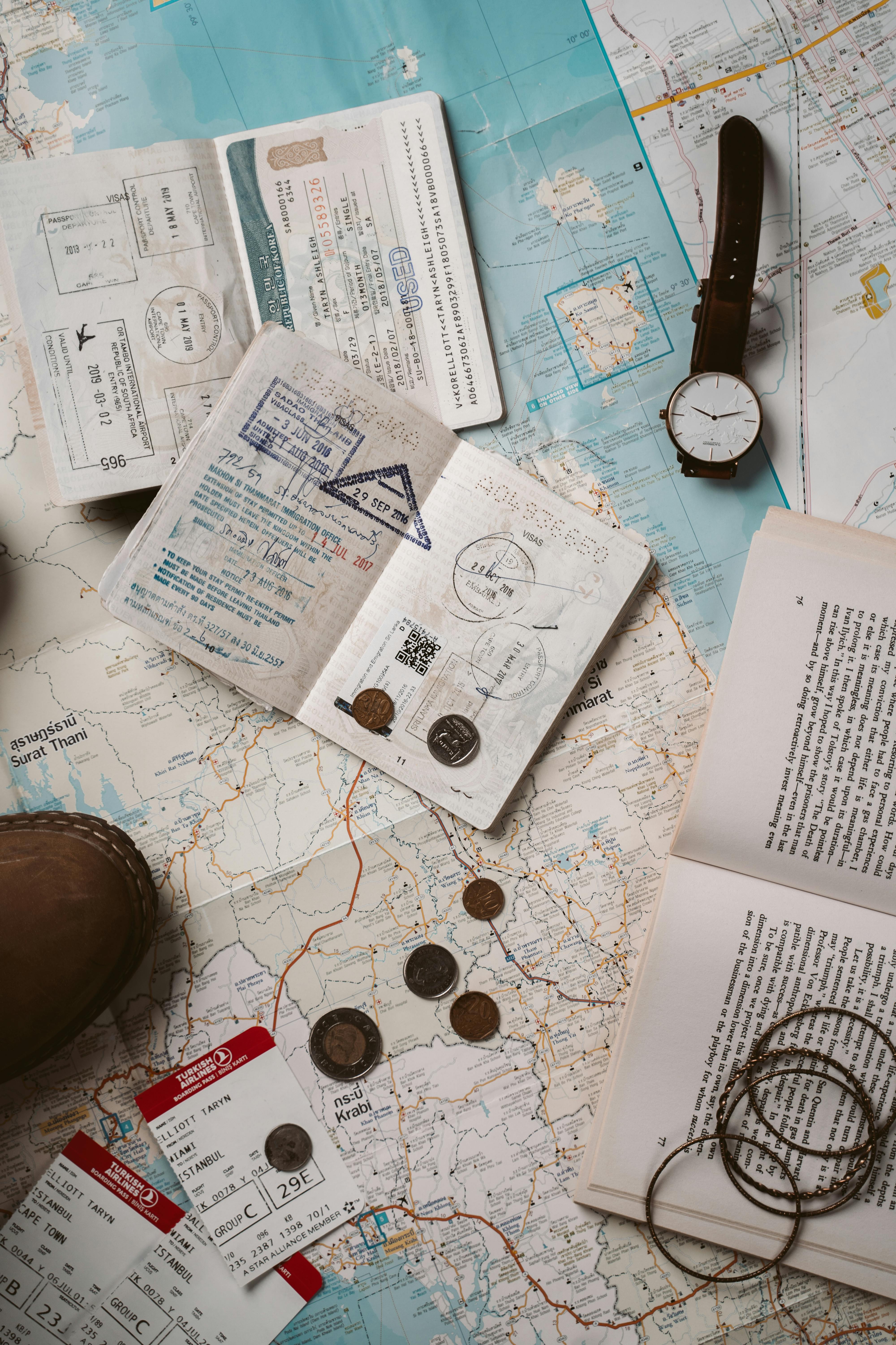 Free Explore wanderlust with flatlay of passport, map, and travel essentials. Stock Photo