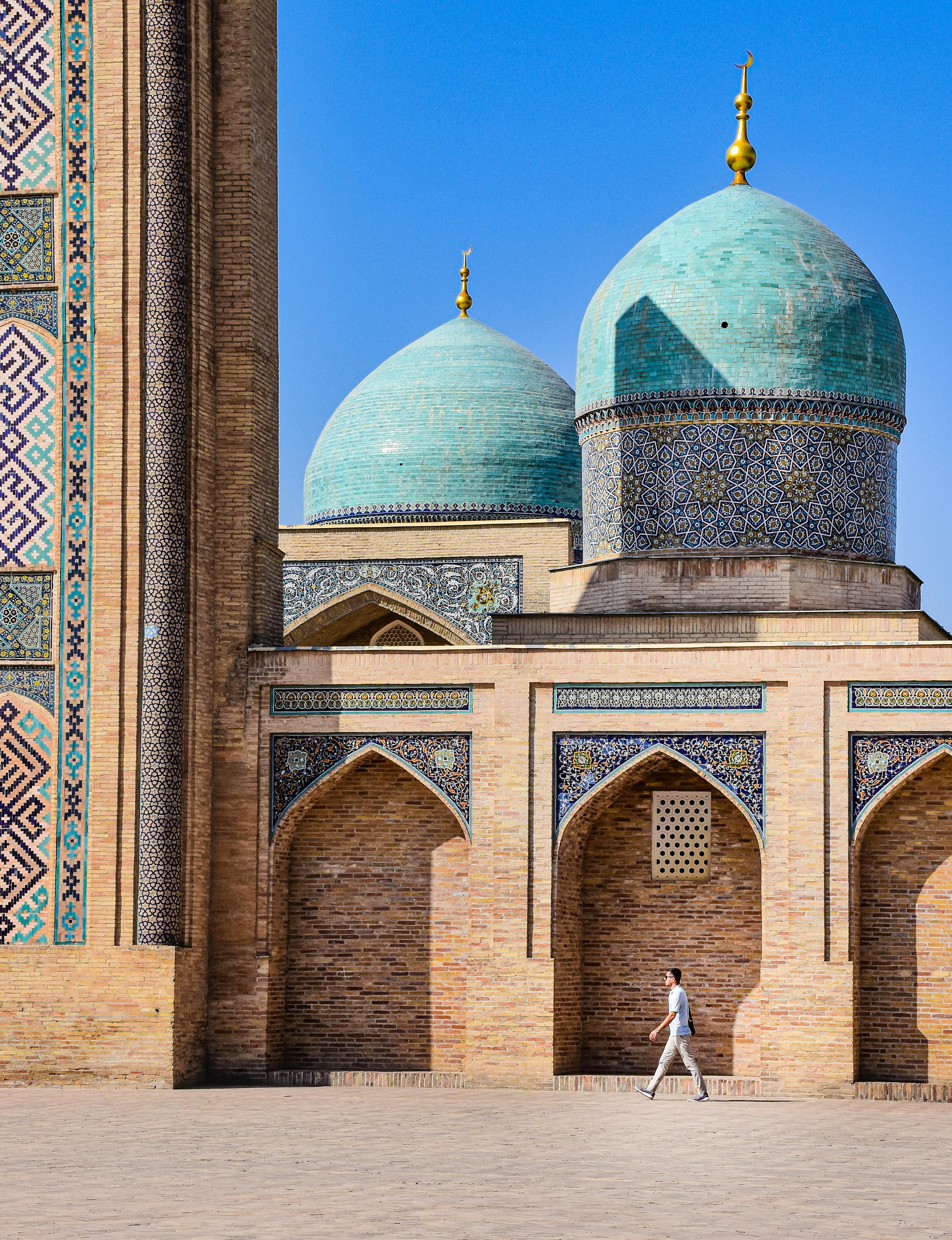 Free A traveler walking by the stunning architecture of a mosque in Tashkent, Uzbekistan. Stock Photo